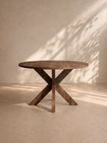 OSORNO - Mesa de comedor redonda 120 cm efecto madera, pata cruzada